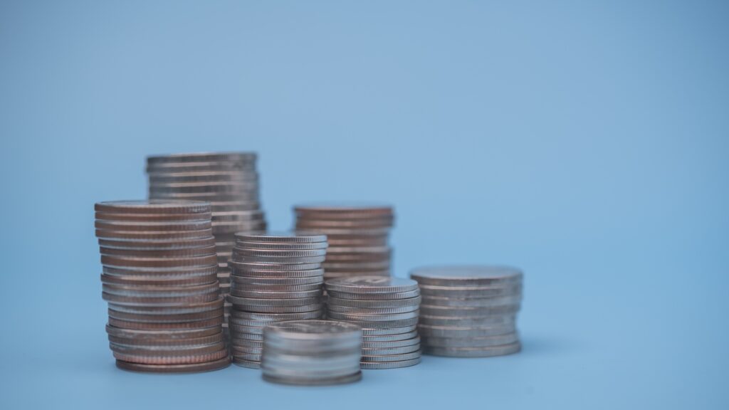 Stacking Coins Building Financial Prosperity and wealth saving money growth inflationary economy